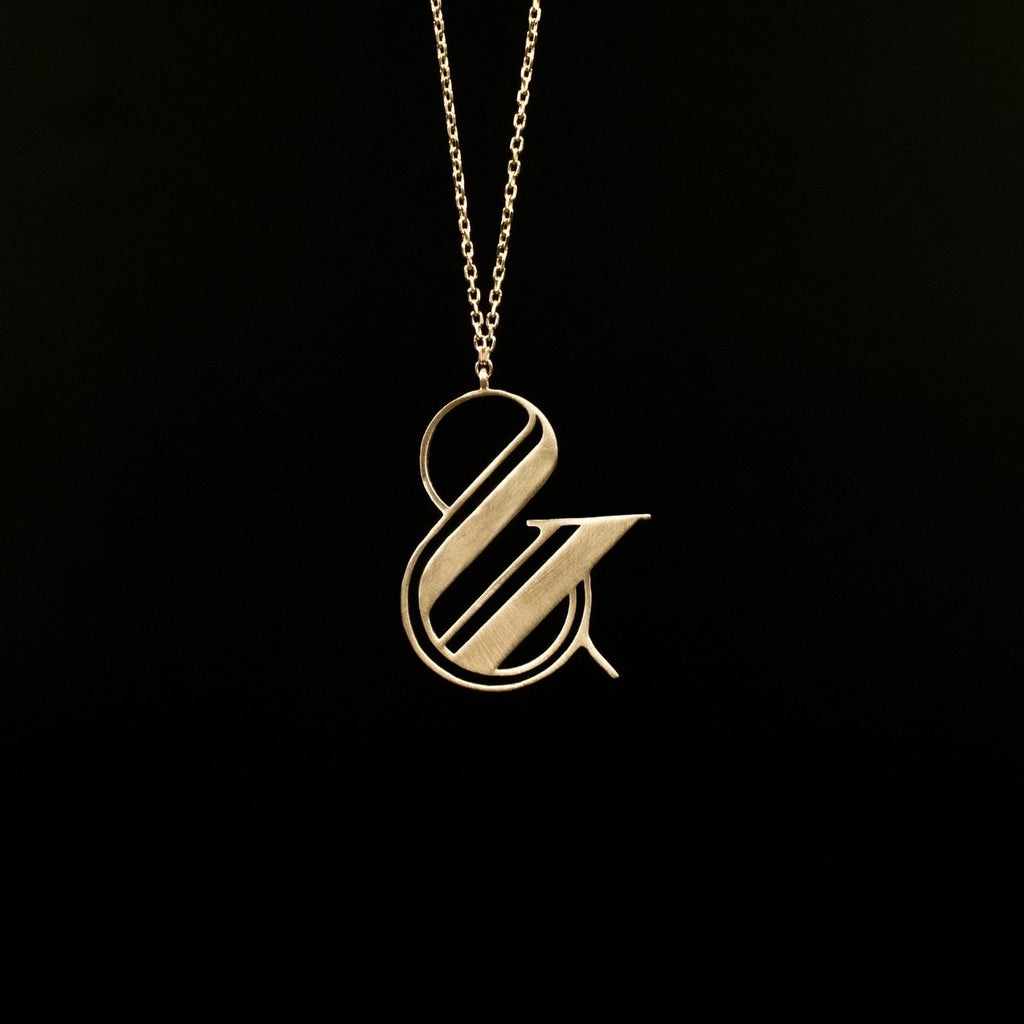 gold ampersand necklace by Moshik Nadav Typography